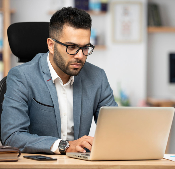 A person organising information on a laptop before a study consultation
